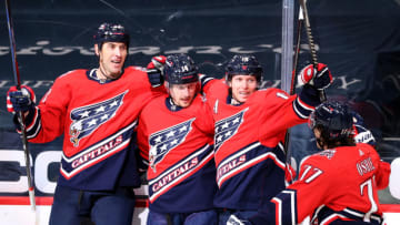 WASHINGTON, DC - FEBRUARY 23: Richard Panik #14 of the Washington Capitals celebrates his goal with teammates against the Pittsburgh Penguins during the second period at Capital One Arena on February 23, 2021 in Washington, DC. (Photo by Patrick Smith/Getty Images)