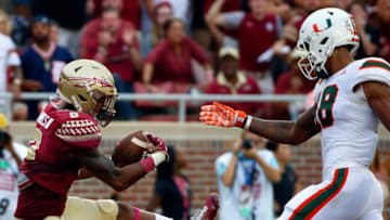 TALLAHASSEE OCTOBER 7: Defensive back Stanford Samuels III #8 of the Florida State Seminoles intercepts a pass intended for wide receiver Lawrence Cager #18 of the Miami Hurricanes during the second half of an NCAA football game at Doak S. Campbell Stadium on October 7, 2017 in Tallahassee, Florida. (Photo by Butch Dill/Getty Images)