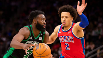 Boston Celtics guard Jaylen Brown (7) drives to the basket against Detroit Pistons guard Cade Cunningham Credit: Raj Mehta-USA TODAY Sports
