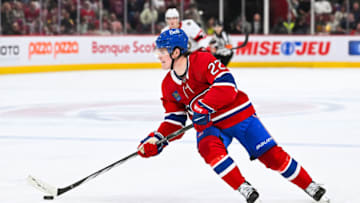 Sep 27, 2023; Montreal, Quebec, CAN; Montreal Canadiens right wing Cole Caufield (22) plays the puck against the Ottawa Senators during the second period at Bell Centre. Mandatory Credit: David Kirouac-USA TODAY Sports