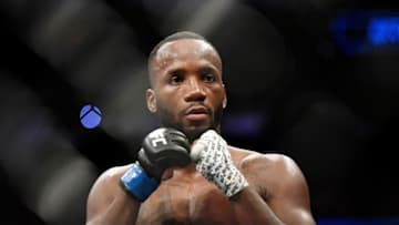 Jul 20, 2019; San Antonio, TX, USA; Leon Edwards (blue gloves) after his win over Rafael Dos Anjos (not pictured) during UFC Fight Night at AT&T Center. Edwards won by unanimous decision. Mandatory Credit: Adam Hagy-USA TODAY Sports