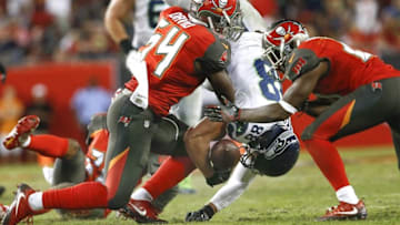Nov 27, 2016; Tampa, FL, USA; Tampa Bay Buccaneers outside linebacker Lavonte David (54) and Tampa Bay Buccaneers cornerback Alterraun Verner (21) combine on the hit against Seattle Seahawks tight end Jimmy Graham (88) to fumble the ball during the second half of an NFL football game at Raymond James Stadium. The Buccaneers won 14-5. Mandatory Credit: Reinhold Matay-USA TODAY Sports
