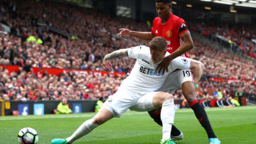 MANCHESTER, ENGLAND - APRIL 30: Alfie Mawson of Swansea City is put under pressure from Marcus Rashford of Manchester United during the Premier League match between Manchester United and Swansea City at Old Trafford on April 30, 2017 in Manchester, England. (Photo by Michael Steele/Getty Images)