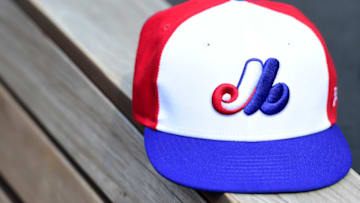 A Montreal Expos baseball hat sits in the Washington Nationals dugout before a game against the Kansas City Royals at Nationals Park on July 6, 2019 in Washington, DC. The Nationals are paying tribute to the Montreal Expos by wearing retro jerseys. (Photo by Patrick McDermott/Getty Images)