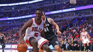 Dec 21, 2015; Chicago, IL, USA; Chicago Bulls forward Bobby Portis (5) chases the ball with Brooklyn Nets guard Bojan Bogdanovic (44) during the second quarter at the United Center. Mandatory Credit: Dennis Wierzbicki-USA TODAY Sports