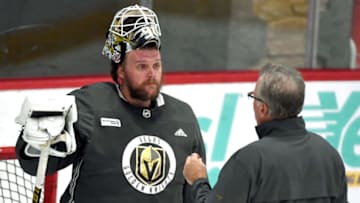 Robin Lehner #90 of the Vegas Golden Knights talks with assistant coach Ryan McGill during a training camp practice at City National Arena. (Photo by Ethan Miller/Getty Images)