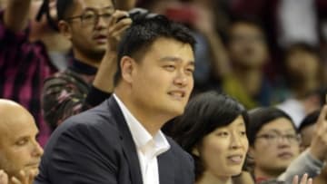 Oct 14, 2015, Shanghai, China; NBA former player Yao Ming watches first half action as the Charlotte Hornets play the Los Angeles Clippers at the Mercedes-Benz Arena. Mandatory Credit: Danny La-USA Today Sports