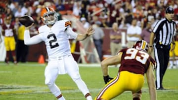 Aug 18, 2014; Landover, MD, USA; Cleveland Browns quarterback Johnny Manziel (2) throws a pass as Washington Redskins linebacker Trent Murphy (93) pressures during the second half at FedEx Field. Mandatory Credit: Brad Mills-USA TODAY Sports