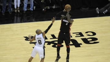Jun 15, 2014; San Antonio, TX, USA; Miami Heat forward LeBron James (6) shoots a three point basket in the first half against the San Antonio Spurs in game five of the 2014 NBA Finals at AT&T Center. Mandatory Credit: Brendan Maloney-USA TODAY Sports