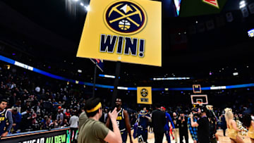 Feb 25, 2020; Denver, Colorado, USA; Denver Nuggets forward Will Barton (5) and floor staff celebrate defeating the Detroit Pistons at the Pepsi Center. Mandatory Credit: Ron Chenoy-USA TODAY Sports
