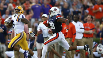 Sep 24, 2016; Auburn, AL, USA; LSU Tigers running back Derris Guice (5) gets past Auburn Tigers defensive back Tray Matthews (28) during the first quarter at Jordan Hare Stadium. Mandatory Credit: John Reed-USA TODAY Sports