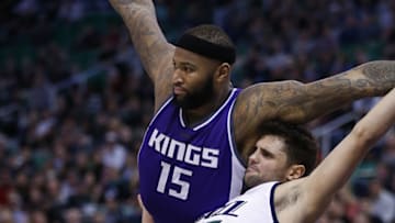Dec 21, 2016; Salt Lake City, UT, USA; Sacramento Kings forward DeMarcus Cousins (15) draws a foul from Utah Jazz guard Raul Neto (25) in the fourth quarter at Vivint Smart Home Arena. The Sacramento Kings defeated the Utah Jazz 94-93. Mandatory Credit: Jeff Swinger-USA TODAY Sports