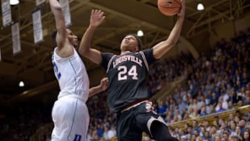 DURHAM, NC - FEBRUARY 21: Dwayne Sutton #24 of the Louisville Cardinals drives against Javin DeLaurier #12 of the Duke Blue Devils during their game at Cameron Indoor Stadium on February 21, 2018 in Durham, North Carolina. Duke won 82-56. (Photo by Grant Halverson/Getty Images)