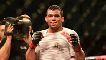 Dec 20, 2014; Barueri, SP, Brazil; Renan Barao (red gloves) celebrates after defeating Mitch Gagnon (blue gloves) during UFC Fight Night at Jose Correa Arena. Mandatory Credit: Jason Silva-USA TODAY Sports