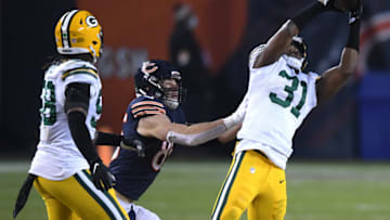 CHICAGO, ILLINOIS - JANUARY 03: Adrian Amos #31 of the Green Bay Packers intercepts a pass by Mitchell Trubisky #10 of the Chicago Bears during the fourth quarter in the game at Soldier Field on January 03, 2021 in Chicago, Illinois. (Photo by Quinn Harris/Getty Images)