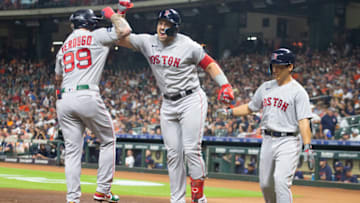 Aug 21, 2023; Houston, Texas, USA; Boston Red Sox center fielder Adam Duvall (18) celebrates his three run home run with right fielder Alex Verdugo (99) and left fielder Masataka Yoshida (7) against the Houston Astros in the first inning at Minute Maid Park. Mandatory Credit: Thomas Shea-USA TODAY Sports