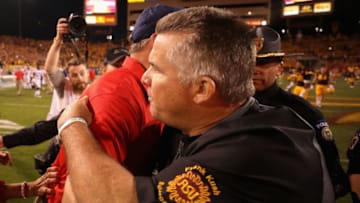 TEMPE, AZ - NOVEMBER 25: Head coaches Rich Rodriguez of the Arizona Wildcats and Todd Graham of the Arizona State Sun Devils shake hands following the college football game at Sun Devil Stadium on November 25, 2017 in Tempe, Arizona. The Sun Devils defeated the Wildcats 42-30 (Photo by Christian Petersen/Getty Images)