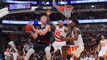 Mar 25, 2016; Chicago, IL, USA; Gonzaga Bulldogs forward Domantas Sabonis (11) is defended by Syracuse Orange center DaJuan Coleman (32) and forward Tyler Roberson (right) in a semifinal game in the Midwest regional of the NCAA Tournament at United Center. Mandatory Credit: Dennis Wierzbicki-USA TODAY Sports