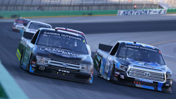 SPARTA, KENTUCKY - JULY 11: Ben Rhodes, driver of the #99 Carolina Nut Ford, and Austin Hill, driver of the #16 Toyota Tsusho Toyota, race during the NASCAR Gander Outdoor Truck Series Buckle Up In Your Truck 225 at Kentucky Speedway on July 11, 2019 in Sparta, Kentucky. (Photo by Matt Sullivan/Getty Images)