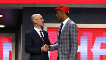 NEW YORK, NY - JUNE 22: John Collins walks on stage with NBA commissioner Adam Silver after being drafted 19th overall by the Atlanta Hawks during the first round of the 2017 NBA Draft at Barclays Center on June 22, 2017 in New York City. NOTE TO USER: User expressly acknowledges and agrees that, by downloading and or using this photograph, User is consenting to the terms and conditions of the Getty Images License Agreement. (Photo by Mike Stobe/Getty Images)