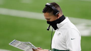 Dec 13, 2020; Detroit, Michigan, USA; Green Bay Packers head coach Matt LaFleur looks at his play sheet during the first quarter against the Detroit Lions at Ford Field. Mandatory Credit: Raj Mehta-USA TODAY Sports