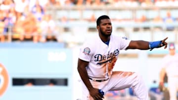 LOS ANGELES, CA - SEPTEMBER 03: Yasiel Puig #66 of the Los Angeles Dodgers reacts as he challenges an out call stealing second base during the third inning against the New York Mets at Dodger Stadium on September 3, 2018 in Los Angeles, California. (Photo by Harry How/Getty Images)