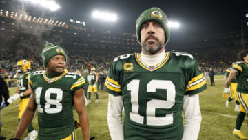GREEN BAY, WISCONSIN - JANUARY 08: Aaron Rodgers #12 and Randall Cobb #18 of the Green Bay Packers walk off the field after losing to the Detroit Lions at Lambeau Field on January 08, 2023 in Green Bay, Wisconsin. (Photo by Patrick McDermott/Getty Images)