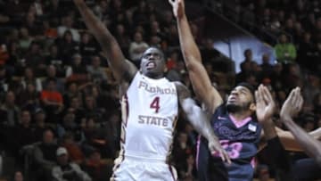 Feb 20, 2016; Blacksburg, VA, USA; Florida State Seminoles guard Dwayne Bacon (4) shoots while being defended by Virginia Tech Hokies guard Jalen Hudson (23) in the first half at Cassell Coliseum. Mandatory Credit: Michael Shroyer-USA TODAY Sports
