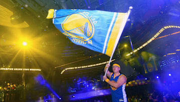 LAS VEGAS, NV - JUNE 17: An empoyee waves a Golden State Warriors flag as the Golden State Warriors celebrate winning the NBA Chamionship at Jewel Nightclub at the Aria Resort