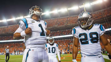 Sep 8, 2016; Denver, CO, USA; Carolina Panthers quarterback Cam Newton (1) does his Superman pose as he celebrates his second quarter touchdown with running back Jonathan Stewart (28) against the Denver Broncos at Sports Authority Field at Mile High. Mandatory Credit: Mark J. Rebilas-USA TODAY Sports