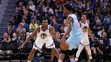 SAN FRANCISCO, CALIFORNIA - FEBRUARY 10: Andrew Wiggins #22 of the Golden State Warriors guards Jimmy Butler #22 of the Miami Heat in the second half against the Miami Heat at Chase Center on February 10, 2020 in San Francisco, California. NOTE TO USER: User expressly acknowledges and agrees that, by downloading and/or using this photograph, user is consenting to the terms and conditions of the Getty Images License Agreement. (Photo by Lachlan Cunningham/Getty Images)