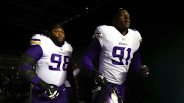 (Photo by Al Bello/Getty Images) Linval Joseph and Stephen Weatherly