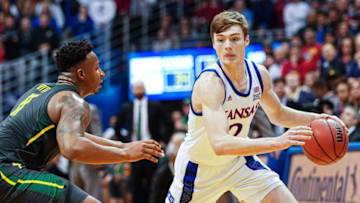 Kansas basketball guard Christian Braun (2) dribbles the ball against Baylor Bears. Mandatory Credit: Jay Biggerstaff-USA TODAY Sports
