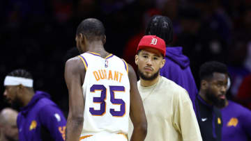 PHILADELPHIA, PENNSYLVANIA - NOVEMBER 04: Devin Booker #1 of the Phoenix Suns looks on past Kevin Durant #35 during the third quarter against the Philadelphia 76ers at the Wells Fargo Center on November 04, 2023 in Philadelphia, Pennsylvania. NOTE TO USER: User expressly acknowledges and agrees that, by downloading and or using this photograph, User is consenting to the terms and conditions of the Getty Images License Agreement. (Photo by Tim Nwachukwu/Getty Images)