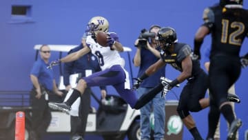 Dec 26, 2015; Dallas, TX, USA; Washington Huskies wide receiver Dante Pettis (8) is knocked out of bounds by Southern Miss Golden Eagles defensive back Kalan Reed (11) in the first quarter at Cotton Bowl Stadium. Mandatory Credit: Tim Heitman-USA TODAY Sports
