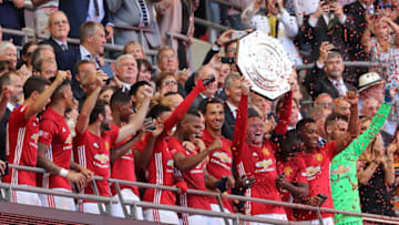 LONDON, ENGLAND - AUGUST 07: Wayne Rooney of Manchester United lifts the trophy during The FA Community Shield match between Manchester United and Leicester City at Wembley Stadium on August 7, 2016 in London, England. (Photo by Matthew Ashton - AMA/Getty Images)