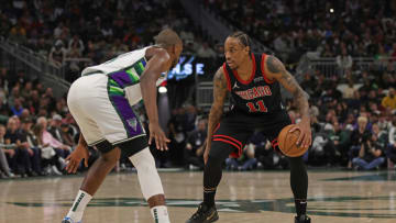 MILWAUKEE, WISCONSIN - APRIL 17: DeMar DeRozan #11 of the Chicago Bulls is defended by Khris Middleton #22 of the Milwaukee Bucks during the second quarter of Game One of the Eastern Conference First Round Playoffs at Fiserv Forum on April 17, 2022 in Milwaukee, Wisconsin. NOTE TO USER: User expressly acknowledges and agrees that, by downloading and or using this photograph, User is consenting to the terms and conditions of the Getty Images License Agreement. (Photo by Stacy Revere/Getty Images)
