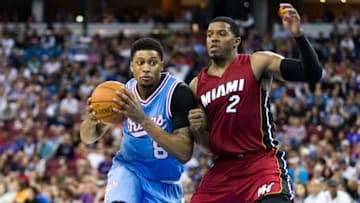 Apr 1, 2016; Sacramento, CA, USA; Sacramento Kings forward Rudy Gay (8) dribbles past Miami Heat forward Joe Johnson (2) in the fourth quarter at Sleep Train Arena. Miami won 112-106. Mandatory Credit: John Hefti-USA TODAY Sports