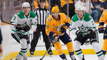 NASHVILLE, TN - FEBRUARY 2: Calle Jarnkrok #19 of the Nashville Predators battles for the puck against John Klingberg #3 and Mattias Janmark #13 of the Dallas Stars at Bridgestone Arena on February 2, 2019 in Nashville, Tennessee. (Photo by John Russell/NHLI via Getty Images)