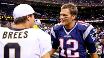 Aug 22, 2015; New Orleans, LA, USA; New England Patriots quarterback Tom Brady (12) talks to New Orleans Saints quarterback Drew Brees (9) following a preseason game at the Mercedes-Benz Superdome. The Patriots defeated the Saints 26-24. Mandatory Credit: Derick E. Hingle-USA TODAY Sports