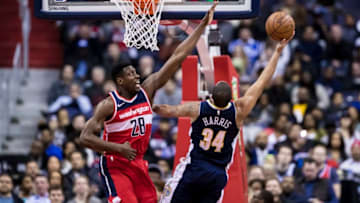 WASHINGTON, DC - MARCH 23: Ian Mahinmi #28 of the Washington Wizards defends Devin Harris #34 of the Denver Nuggets during the second half at Capital One Arena on March 23, 2018 in Washington, DC. NOTE TO USER: User expressly acknowledges and agrees that, by downloading and or using this photograph, User is consenting to the terms and conditions of the Getty Images License Agreement. (Photo by Scott Taetsch/Getty Images)