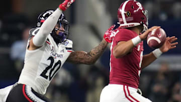 Cincinnati Bearcats linebacker Deshawn Pace pressures Alabama Crimson Tide quarterback Bryce Young. The Enquirer.
