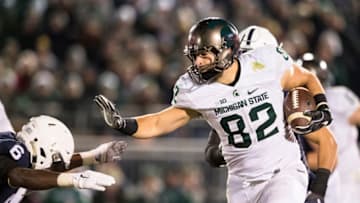 UNIVERSITY PARK, PA - NOVEMBER 26: Josiah Price #82 of the Michigan State Spartans puts out a stiff arm against Malik Golden #6 of the Penn State Nittany Lions during the second half on November 26, 2016 at Beaver Stadium in University Park, Pennsylvania. Penn State defeats Michigan State 45-12 clinching Big Ten East Division Champions. (Photo by Brett Carlsen/Getty Images)
