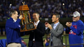 Oct 22, 2016; Chicago, IL, USA; Chicago Cubs owner Tom Ricketts (left) hands the National League Championship Trophy to President of Baseball operations Theo Epstein after game six of the 2016 NLCS playoff baseball series at Wrigley Field. Cubs win 5-0 to advance to the World Series. Mandatory Credit: Jerry Lai-USA TODAY Sports
