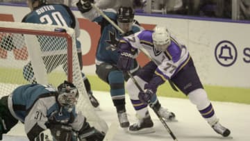 12 Apr 2000: Pierre Turgeon #77 of the St. Louis Blues tries to get a shot in as Vincent Damphousse #25 of the San Jose Sharks defends and Steve Shields #31 of the Sharks protects the goal during Game 1 of the first round of the playoffs at the Kiel Center in St. Louis, Missouri. The Blues won 5-3. DIGITAL IMAGE. Mandatory Credit: Elsa/ALLSPORT