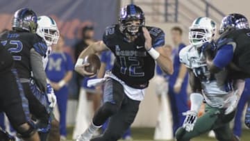 Oct 31, 2015; Memphis, TN, USA; Memphis Tigers quarterback Paxton Lynch (12) carries the ball against Tulane Green Wave defensive end Ade Aruna (87) during the second half at Liberty Bowl Memorial Stadium. Memphis Tigers beat Tulane Green Wave 41 - 13. Mandatory Credit: Justin Ford-USA TODAY Sports
