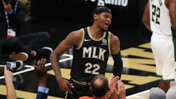 ATLANTA, GEORGIA - JULY 03: Cam Reddish #22 of the Atlanta Hawks celebrates a three point basket against the Milwaukee Bucks during the second half in Game Six of the Eastern Conference Finals at State Farm Arena on July 03, 2021 in Atlanta, Georgia NOTE TO USER: User expressly acknowledges and agrees that, by downloading and or using this photograph, User is consenting to the terms and conditions of the Getty Images License Agreement. (Photo by Kevin C. Cox/Getty Images)