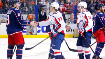 COLUMBUS, OH - APRIL 23: Zach Werenski #8 of the Columbus Blue Jackets shakes hands with T.J. Oshie #77 of the Washington Capitals after the end of Game Six of the Eastern Conference First Round during the 2018 NHL Stanley Cup Playoffs on April 23, 2018 at Nationwide Arena in Columbus, Ohio. Washington defeated Columbus 6-3 to win the series 4-2. (Photo by Kirk Irwin/Getty Images) *** Local Caption *** Zach Werenski;T.J. Oshie