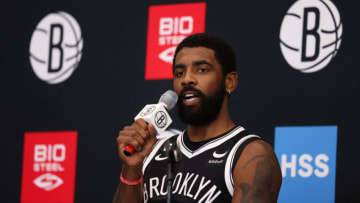 Several Boston Celtics analysts ripped Kyrie Irving for his recent controversial social media share on his personal Twitter account (Photo by Dustin Satloff/Getty Images)