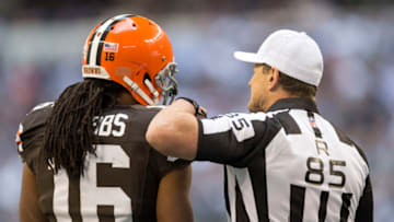 ARLINGTON, TX - NOVEMBER 18: Referee Ed Hochuli and Joshua Cribbs #16 of the Cleveland Browns talk during a game against the Dallas Cowboys at Cowboys Stadium on November 18, 2012 in Arlington, Texas. The Cowboys defeated the Browns 23-20. (Photo by Wesley Hitt/Getty Images)